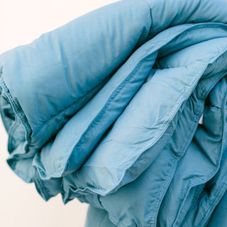 A comforter folded several times