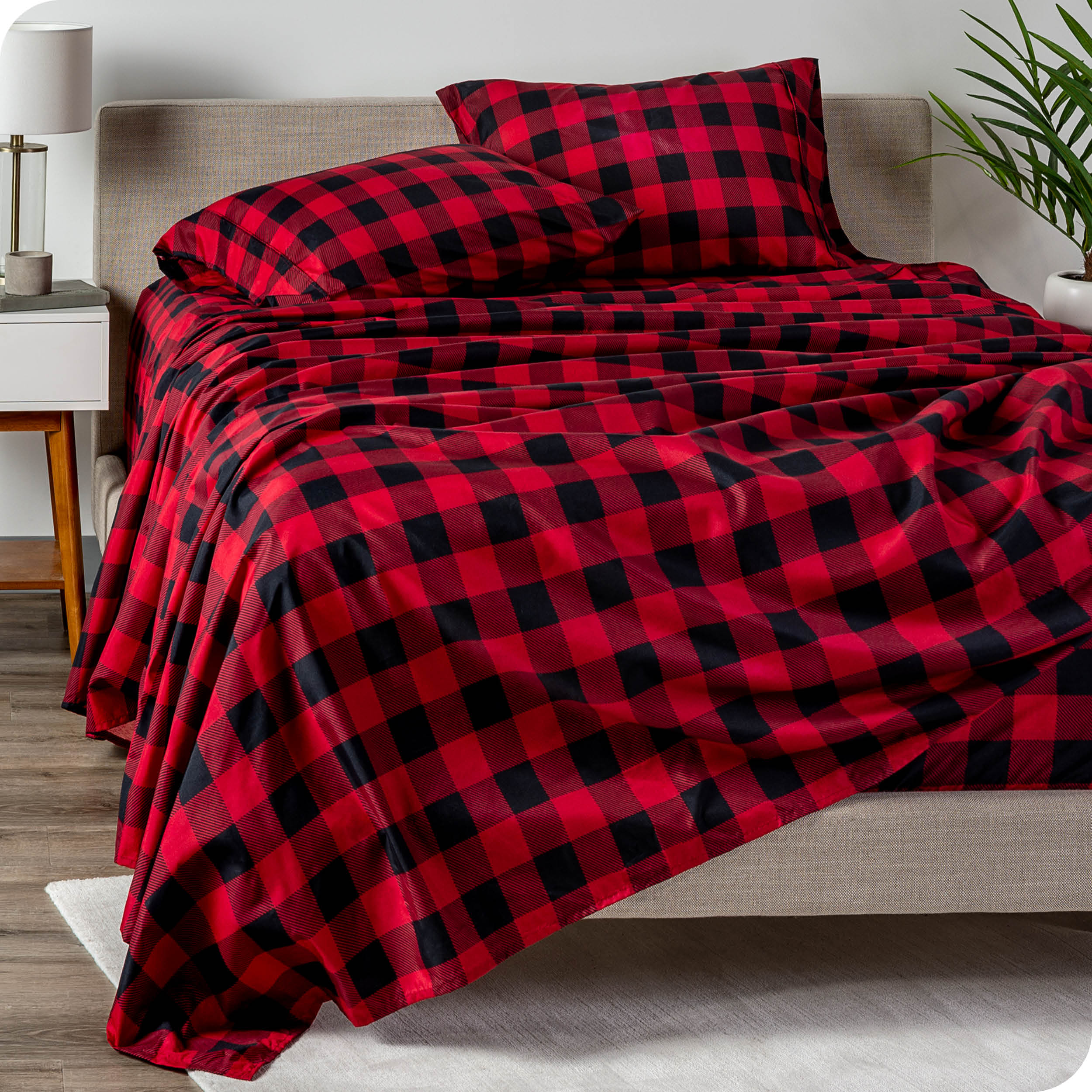 A sideview of a modern bed with a printed microfiber sheet set.