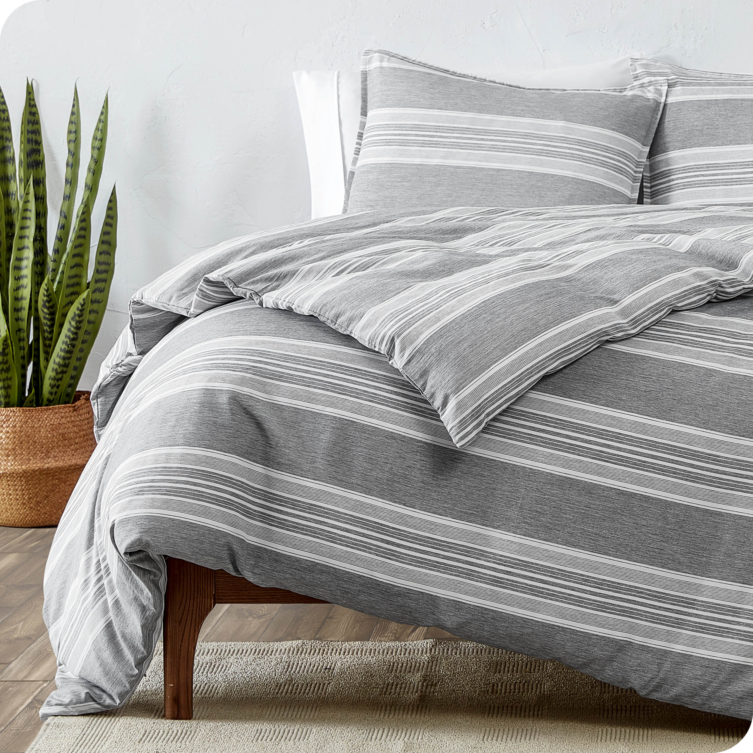 A modern bed with heathered modern plaid microfiber comforter set.