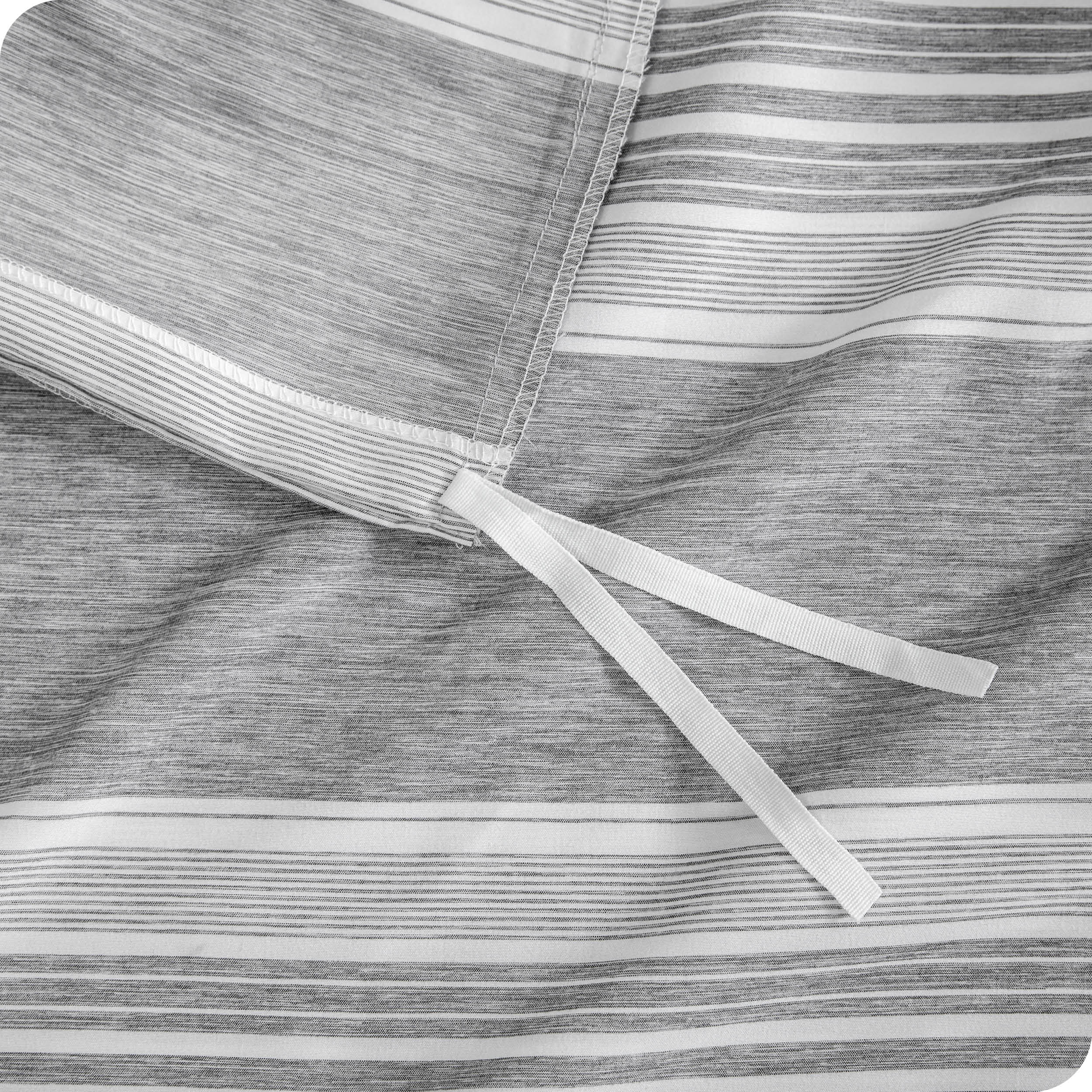 A close up view of the tie of the microfiber duvet cover.