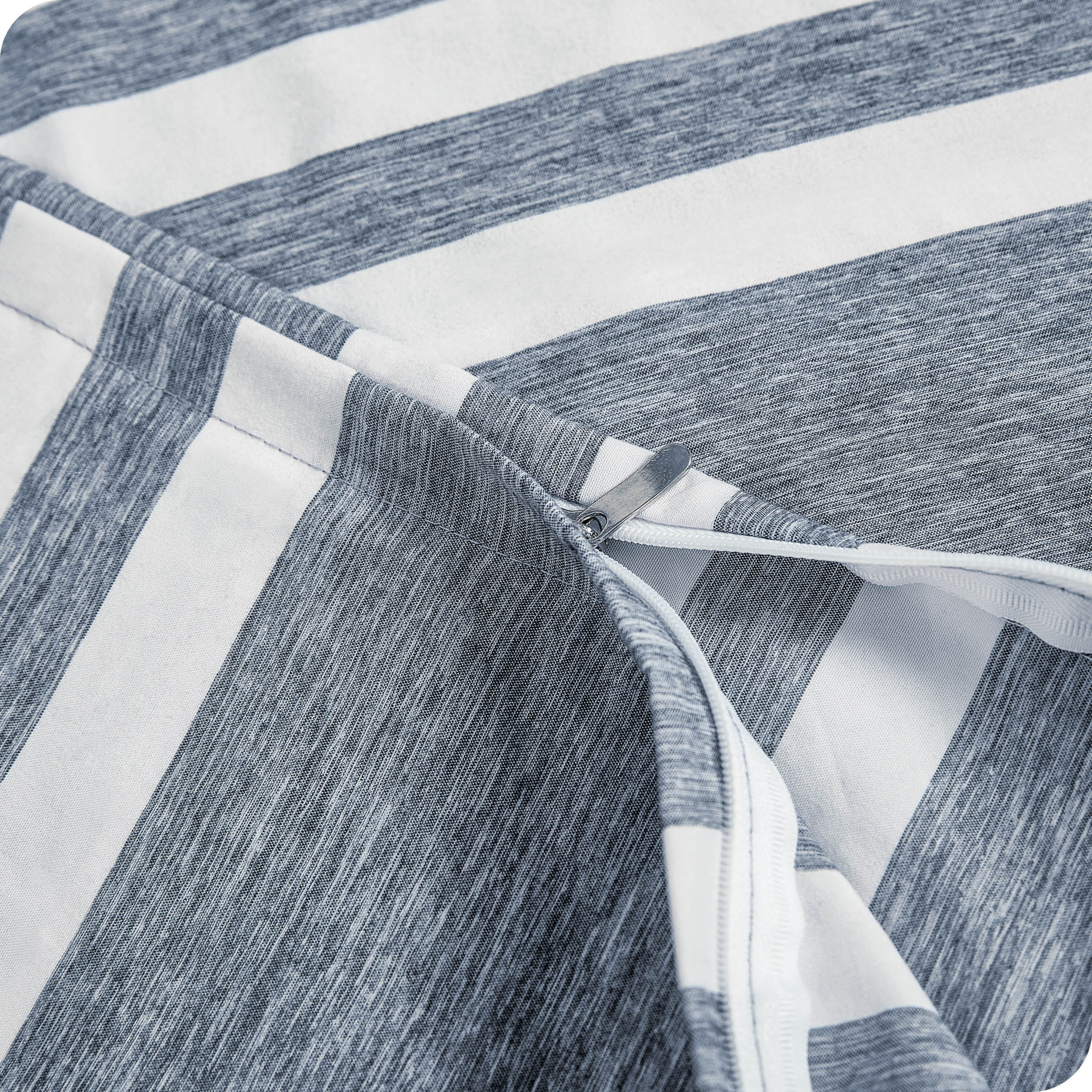 A close up view of the zipper of the microfiber duvet cover.