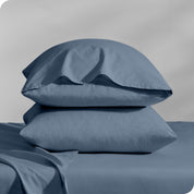 2 percale pillowcases on pillows set on a bed with matching sheets