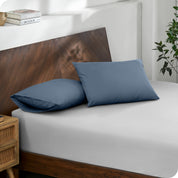 2 pillows with percale pillowcases on a bed