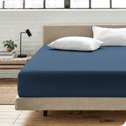An organic cotton fitted sheet on a mattress