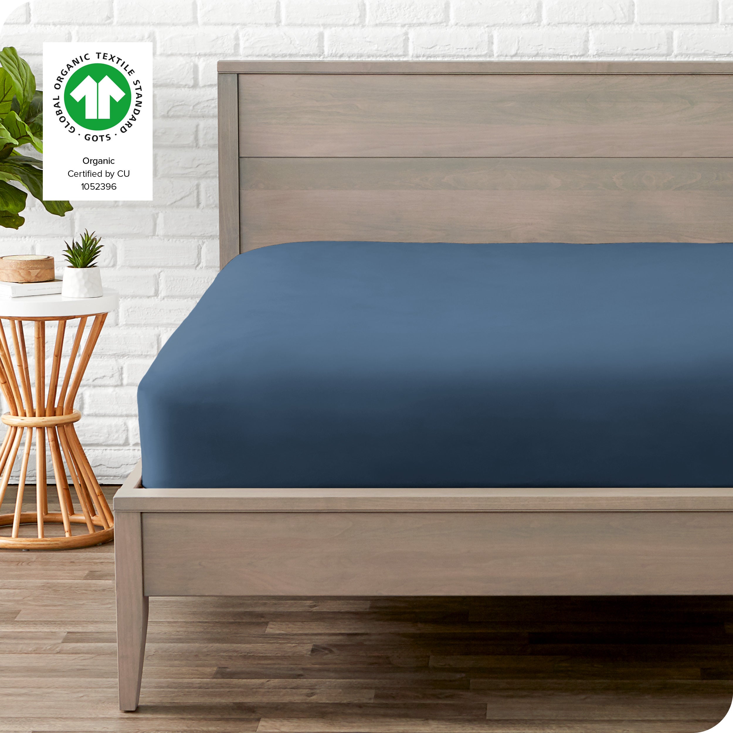An organic percale bottom sheet on a mattress