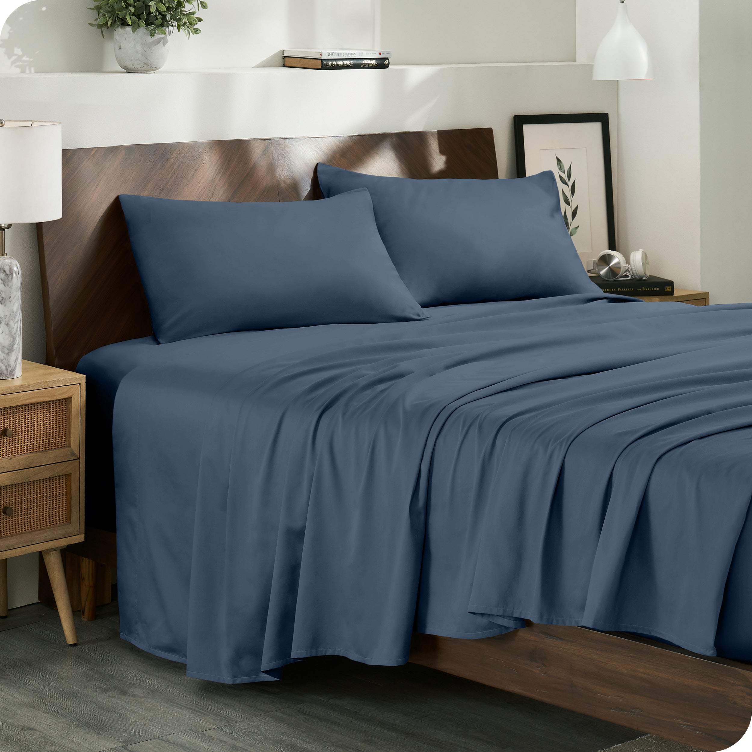 Diagonal view of a decorated room scene with sateen sheets