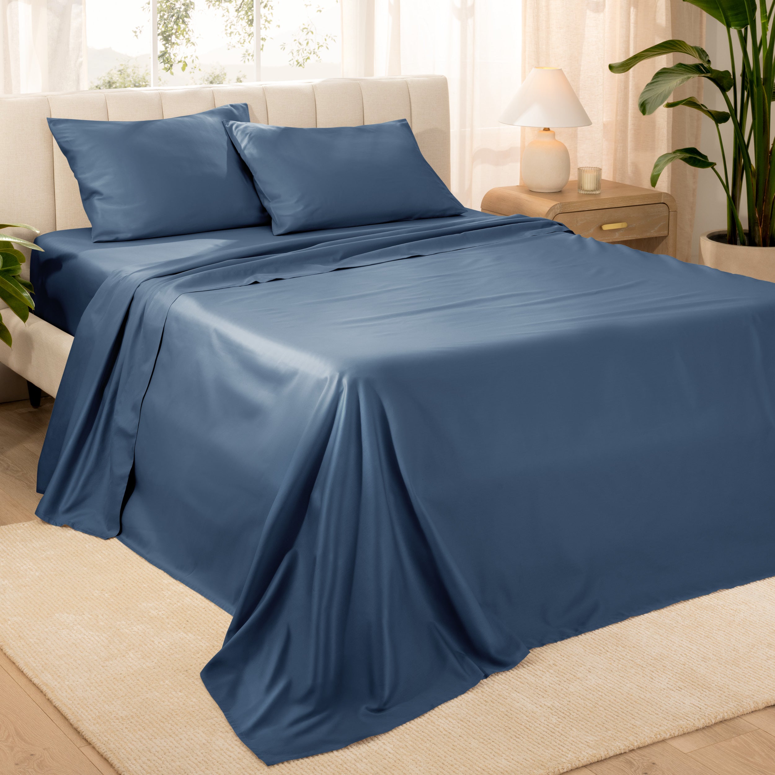 Diagonal view of a decorated room scene with sateen sheets