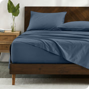 Percale sheets on bed in a modern bedroom
