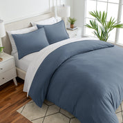 Angled view of bed with a duvet cover folded over on itself