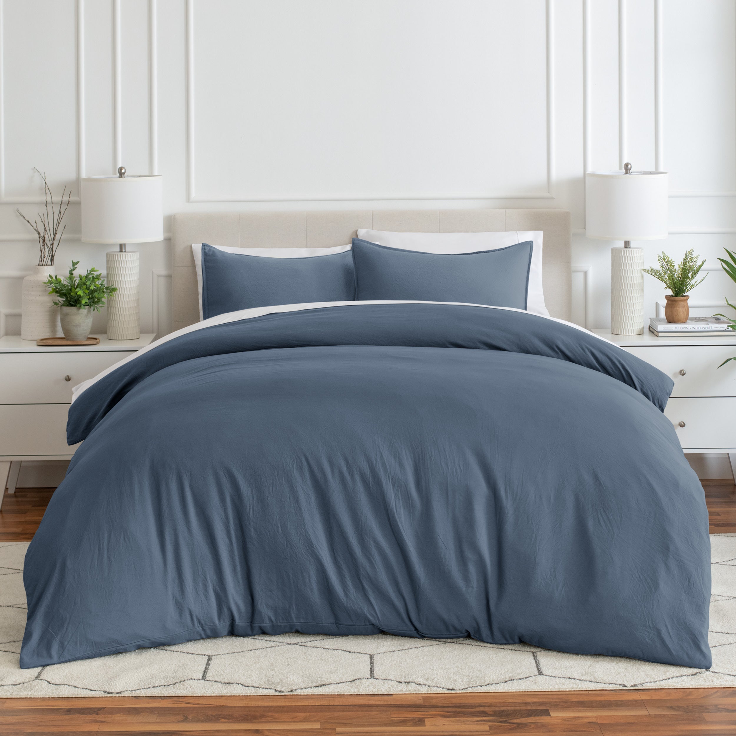 Relaxing room scene with a duvet cover laid out over the bed