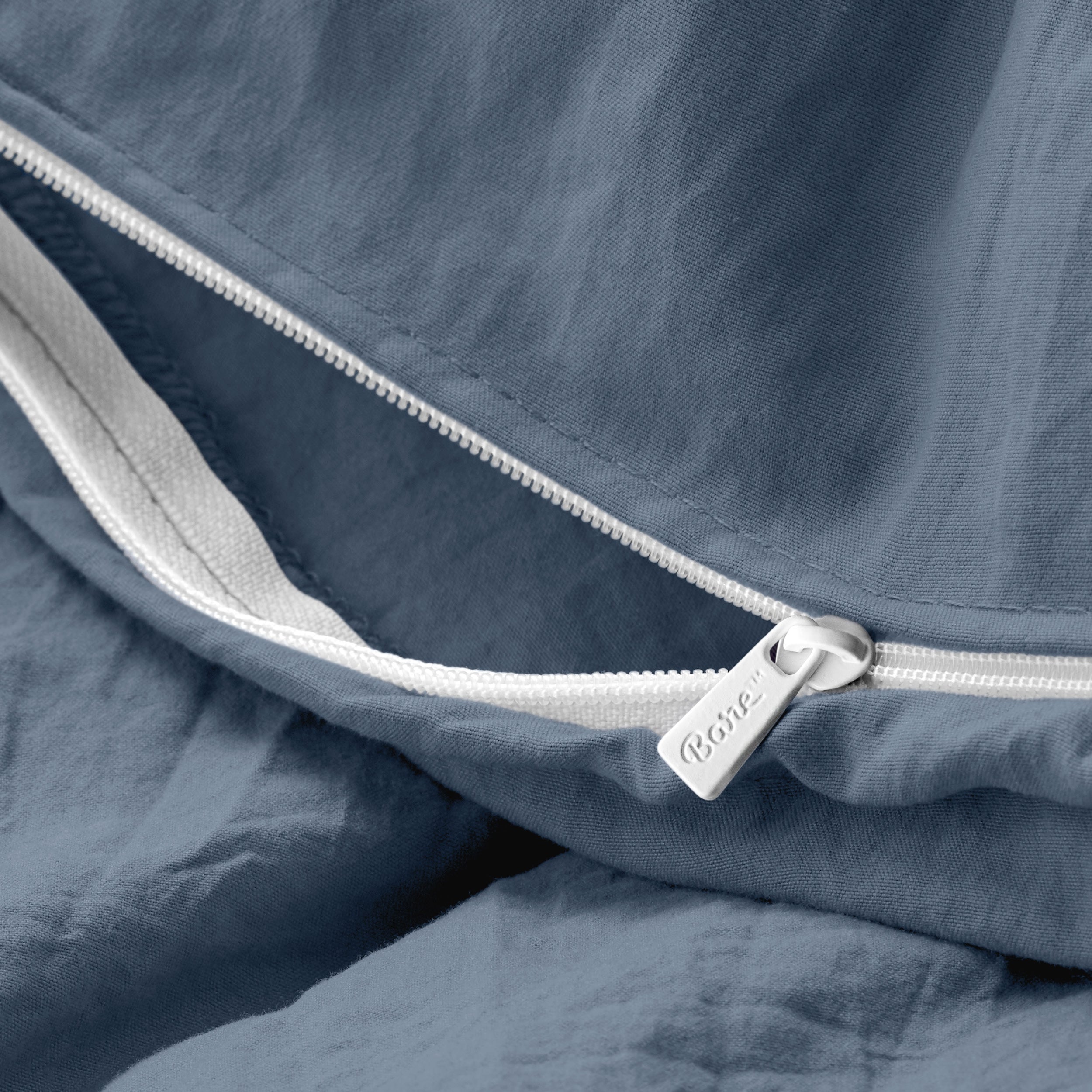 Close up of the zipper on the duvet cover partially opened