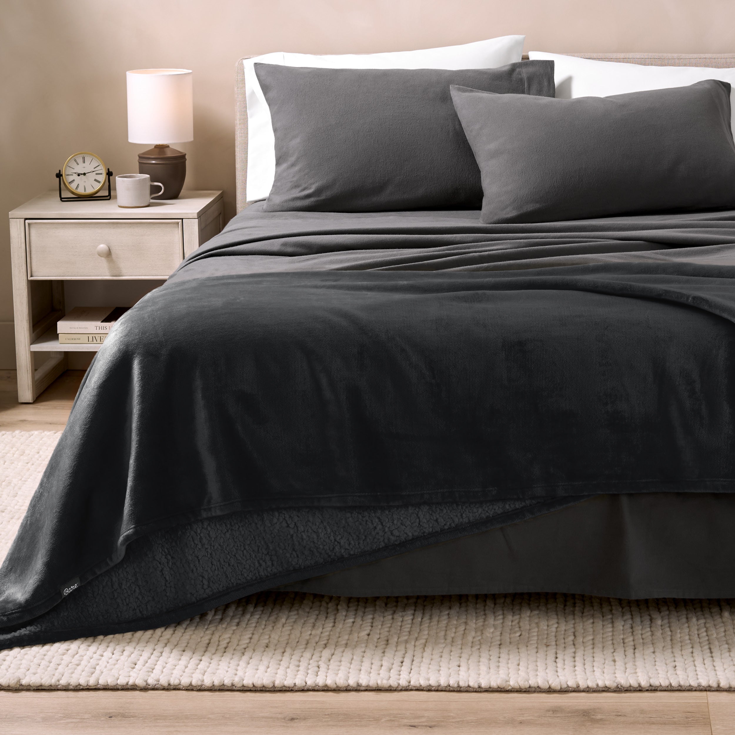 Sherpa Blanket laying on a bed folded over itself part way