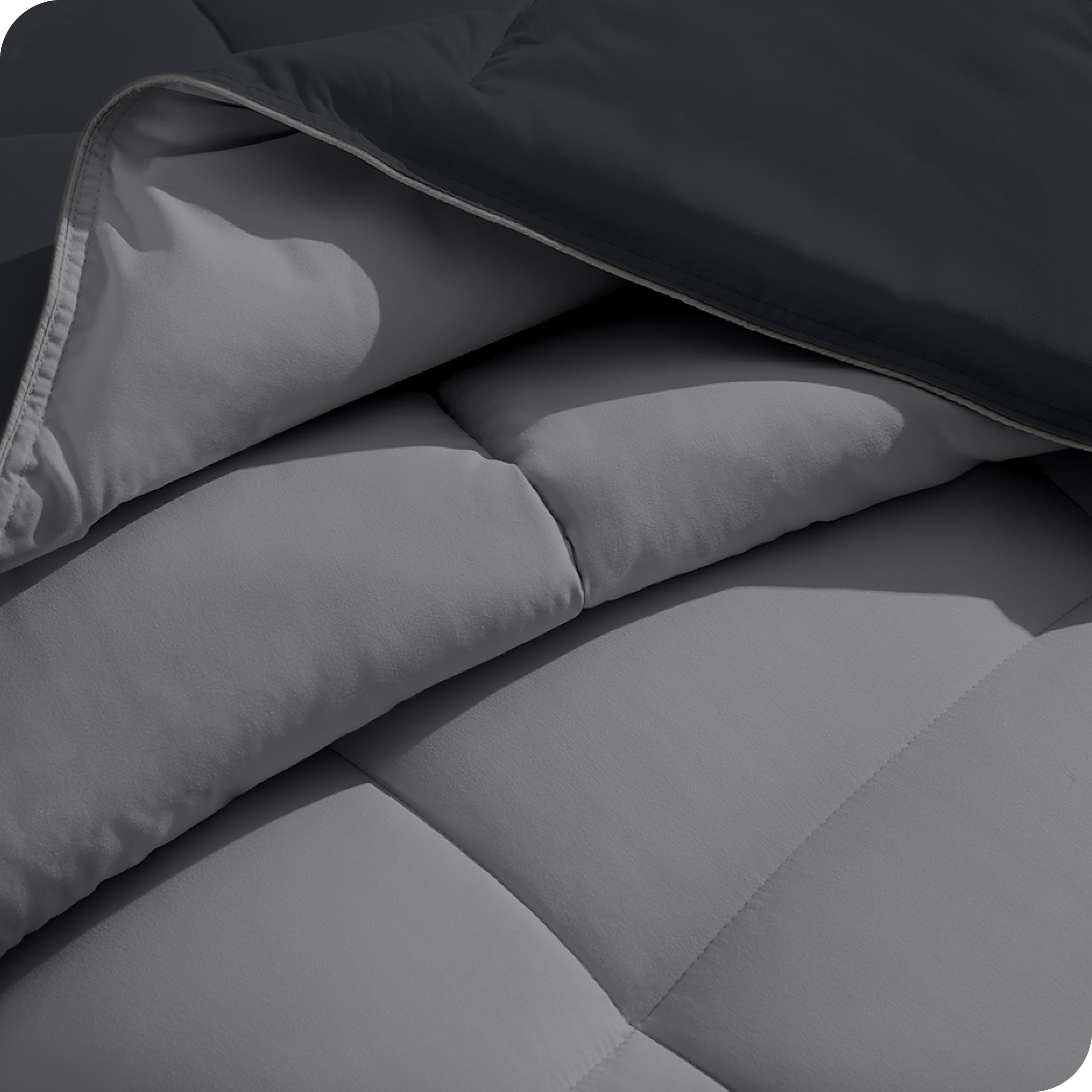 Close up of the comforter folded back showing the two different colored sides.