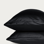 Two bamboo pillowcases on a light gray background