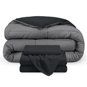 A reversible microfiber comforter and a coordinating sheet set folded and stacked 