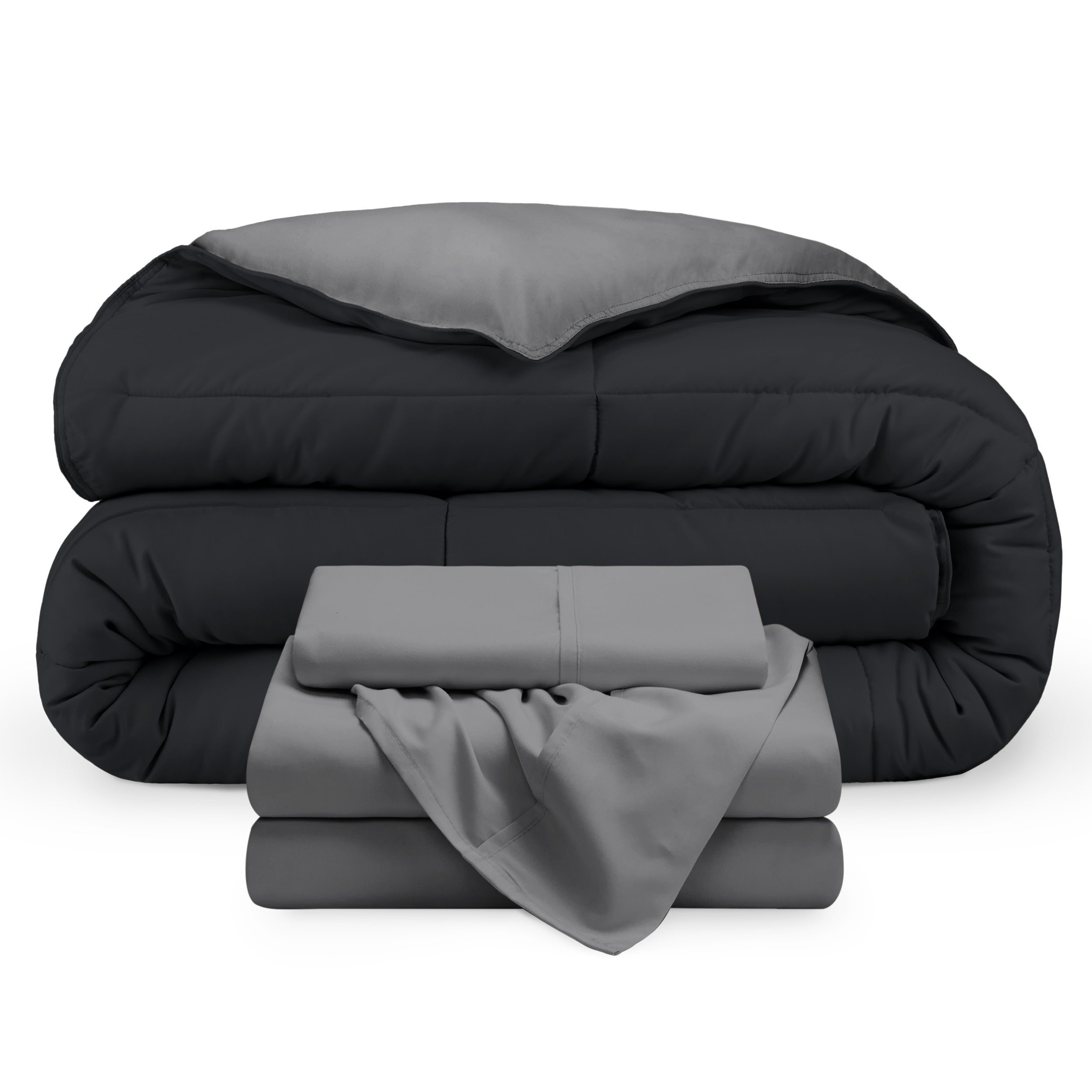 A reversible microfiber comforter and a coordinating sheet set folded and stacked 