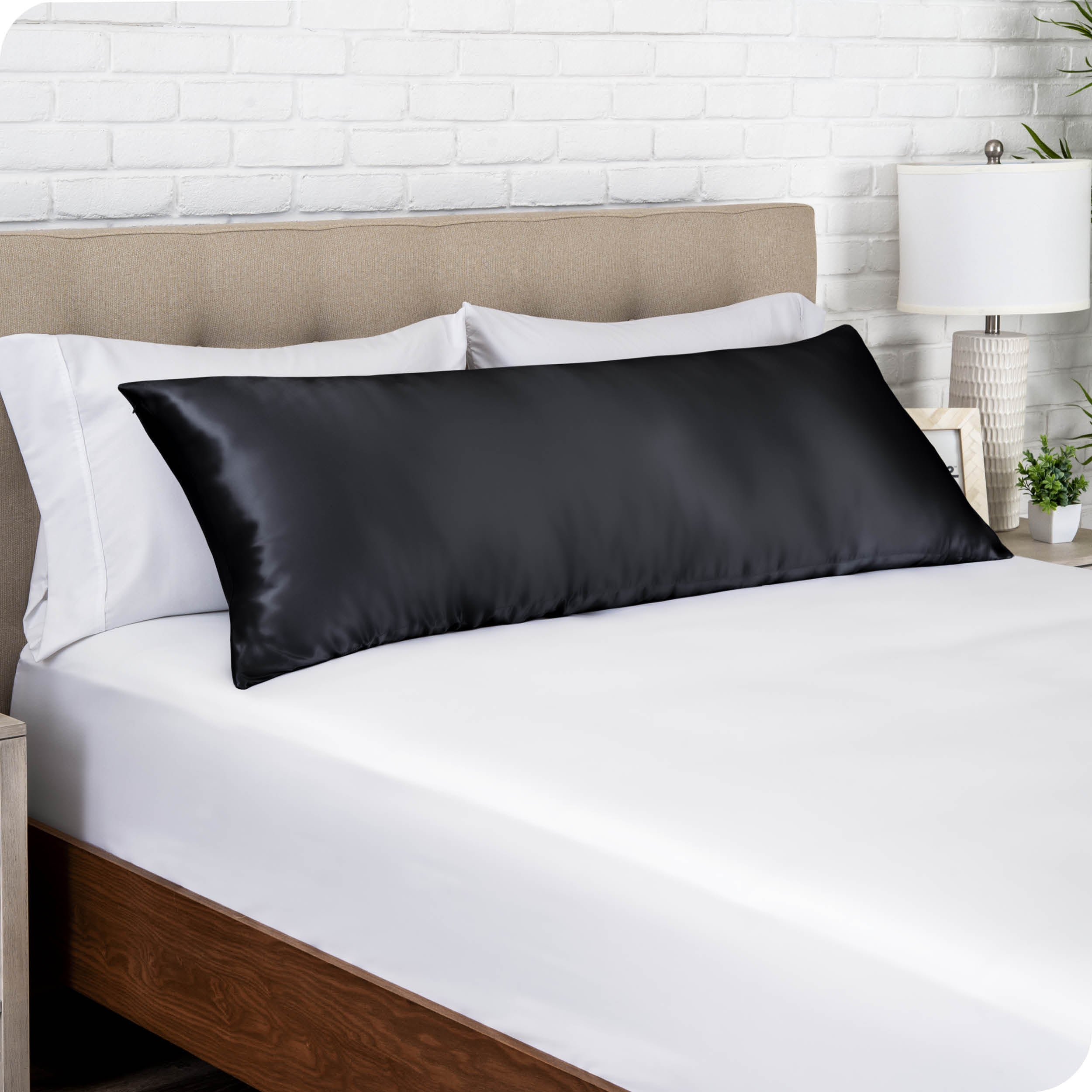 One silk body pillowcase covering a pillow on a bed
