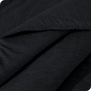 A close up of a corner of the microfiber comforter
