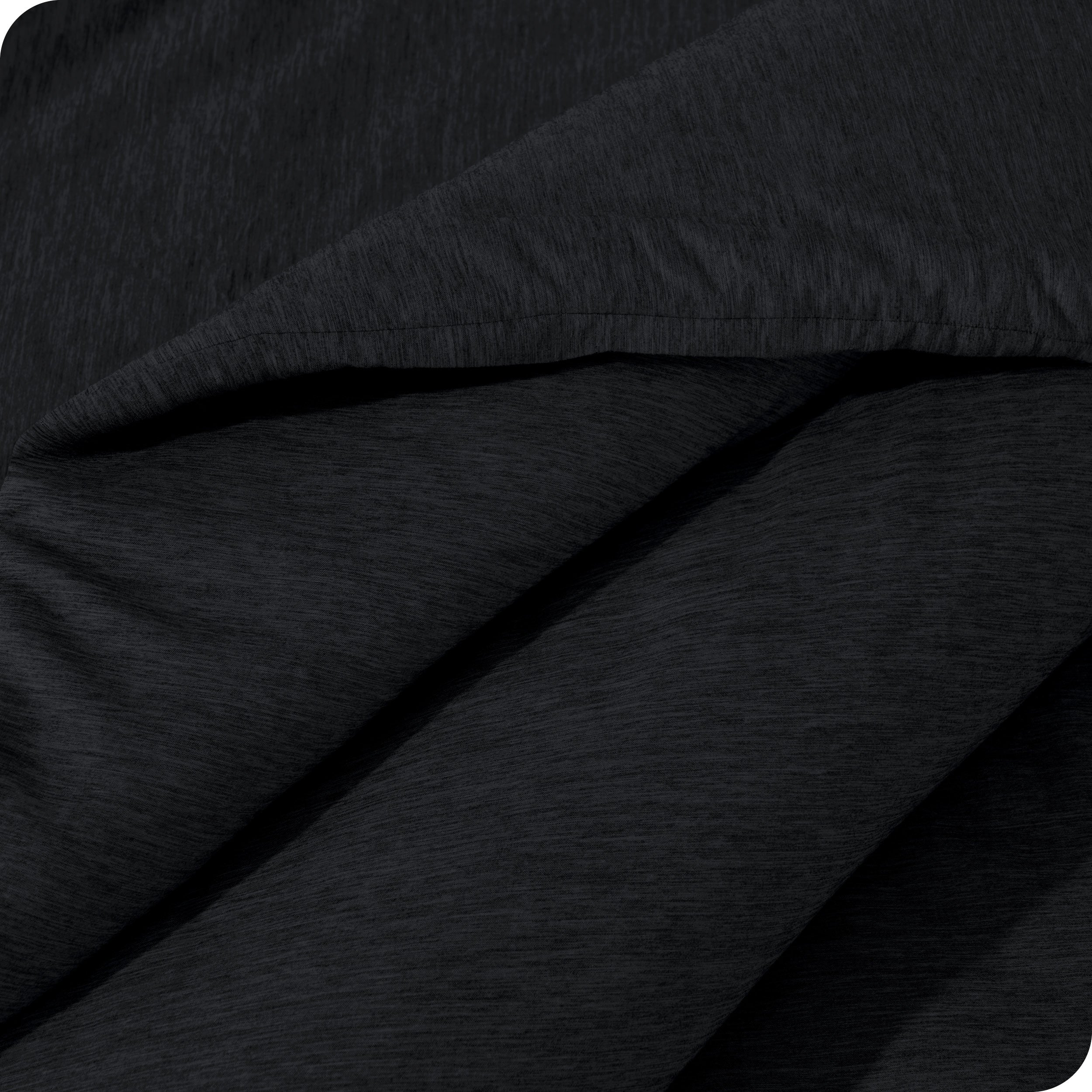 A close up of a corner of the microfiber comforter
