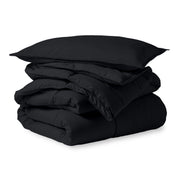 A microfiber comforter folded neatly with a pillow from above