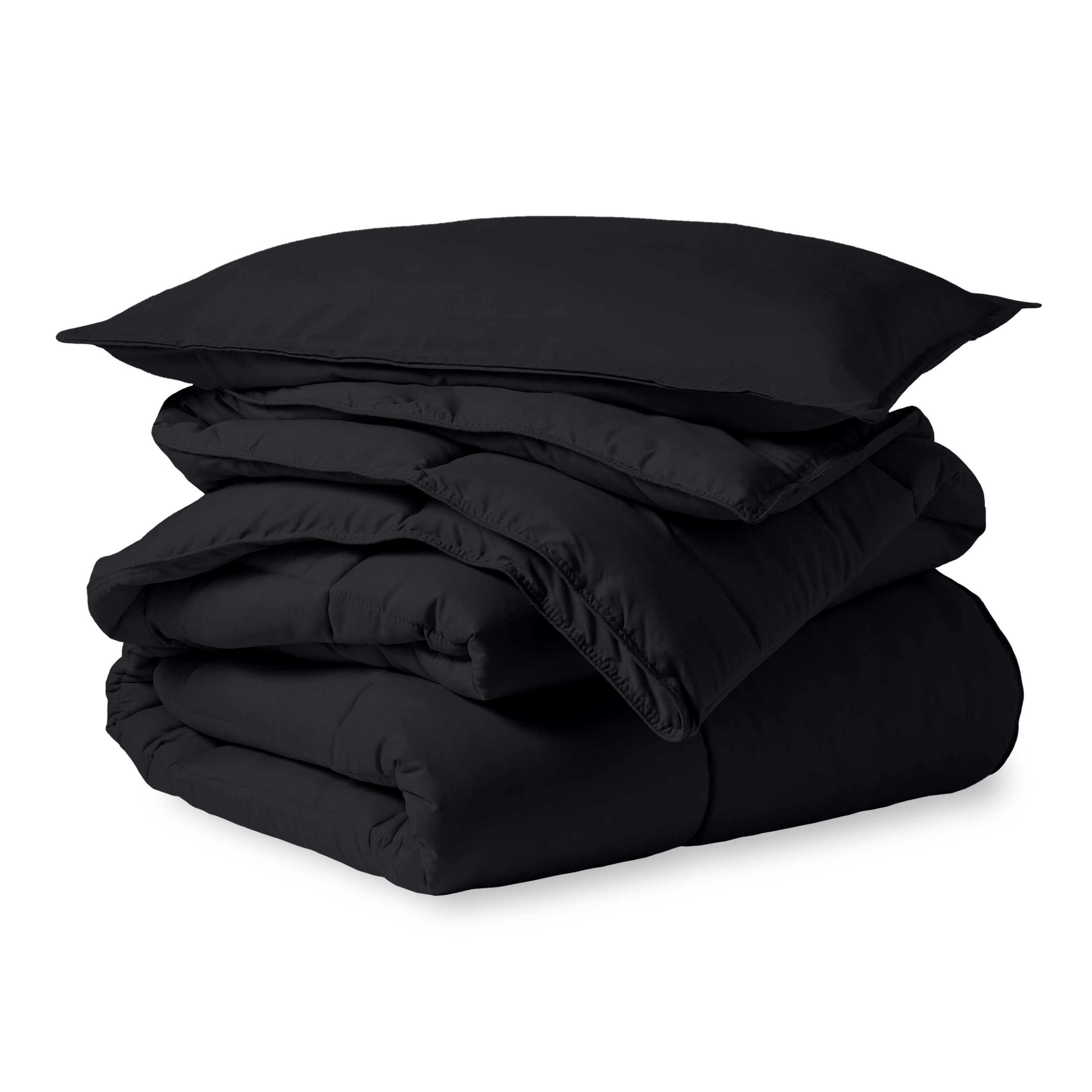 A microfiber comforter folded neatly with a pillow from above