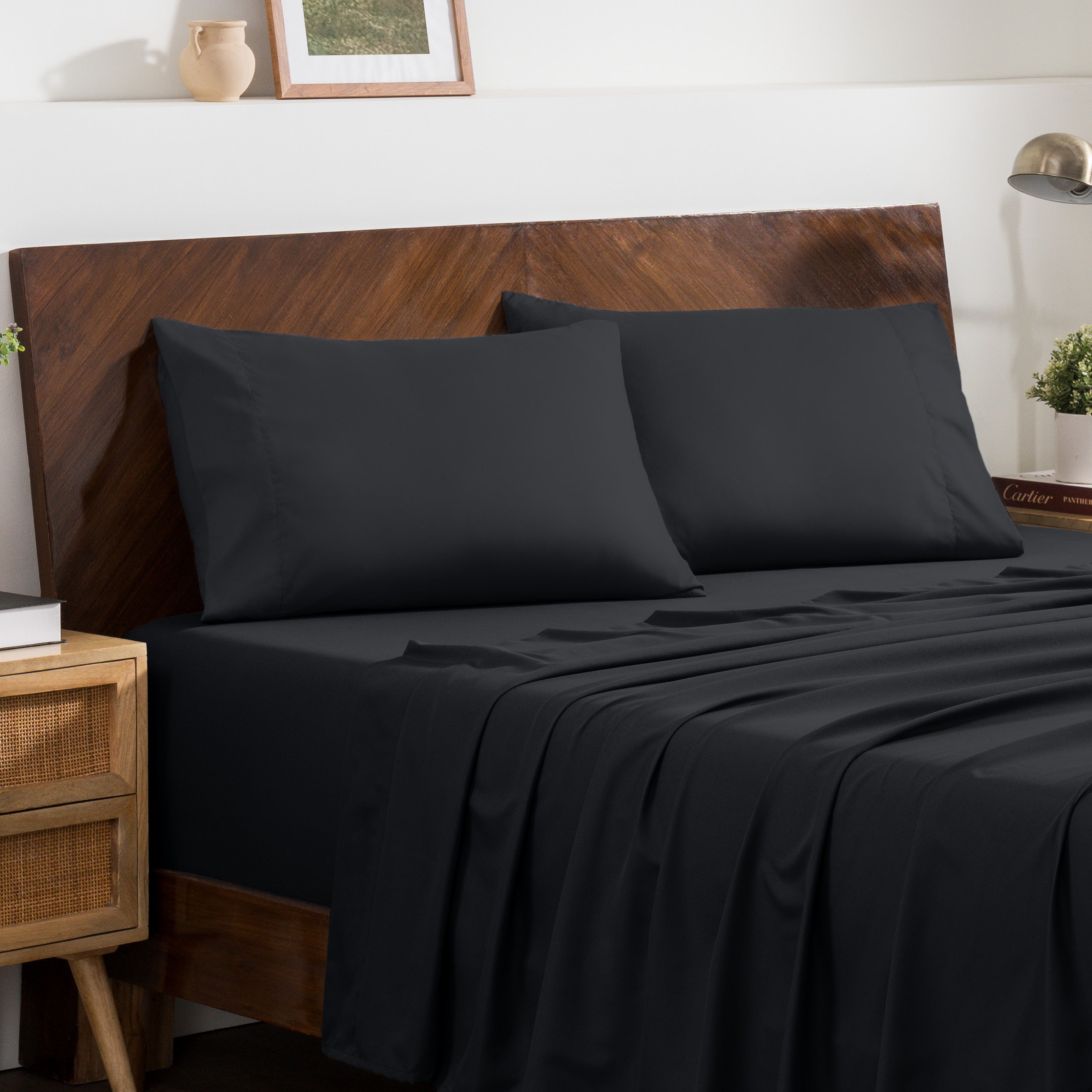 2 pillowcases on pillows on a nicely made bed