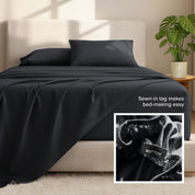 Microfiber bed sheets and pillows on a bed with a plant in the background