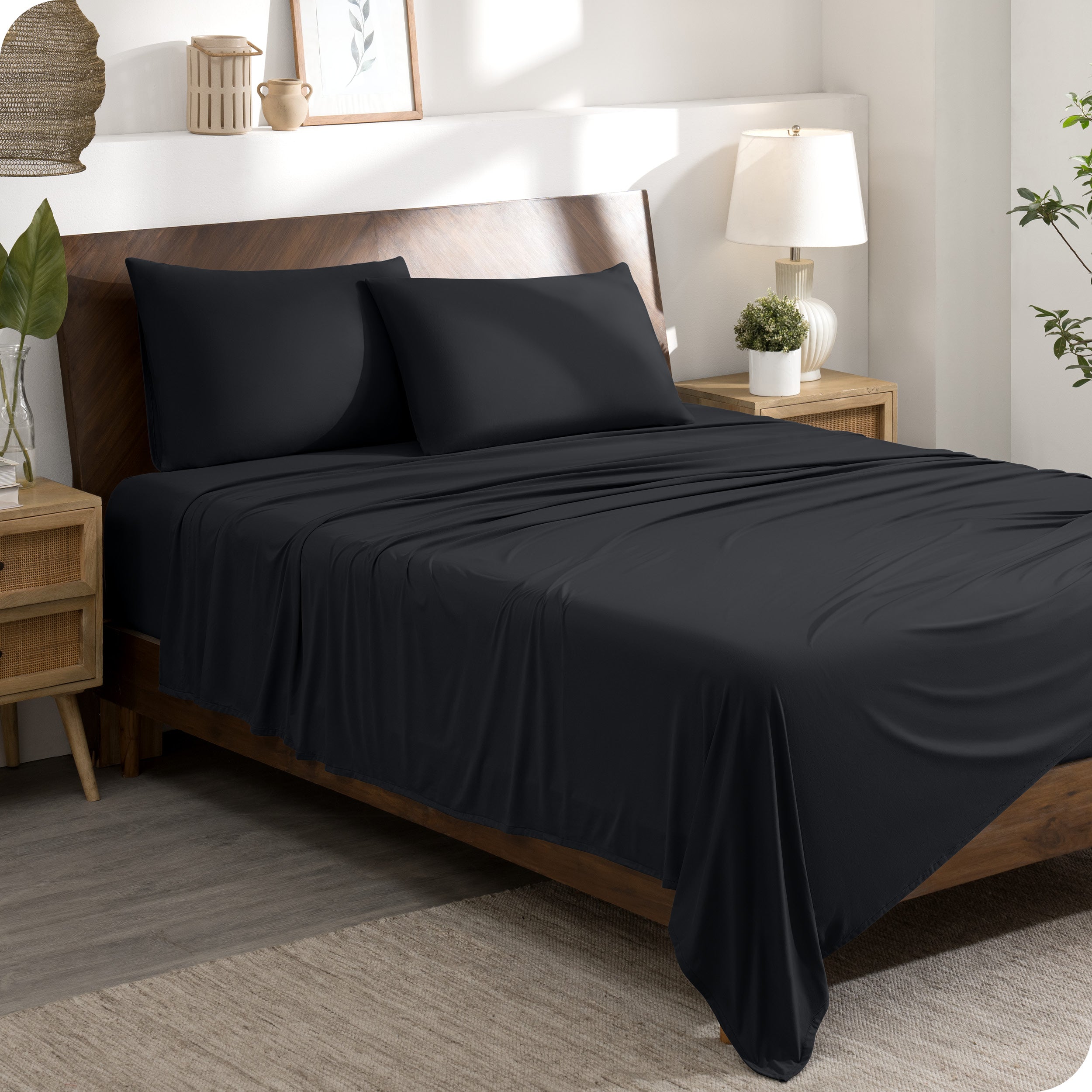 A stretch knit microfiber sheet set on a bed