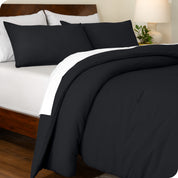 A side view of a bed made with a track stitch comforter set