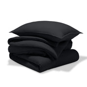 A comforter folded with a matching pillow sham stacked on top