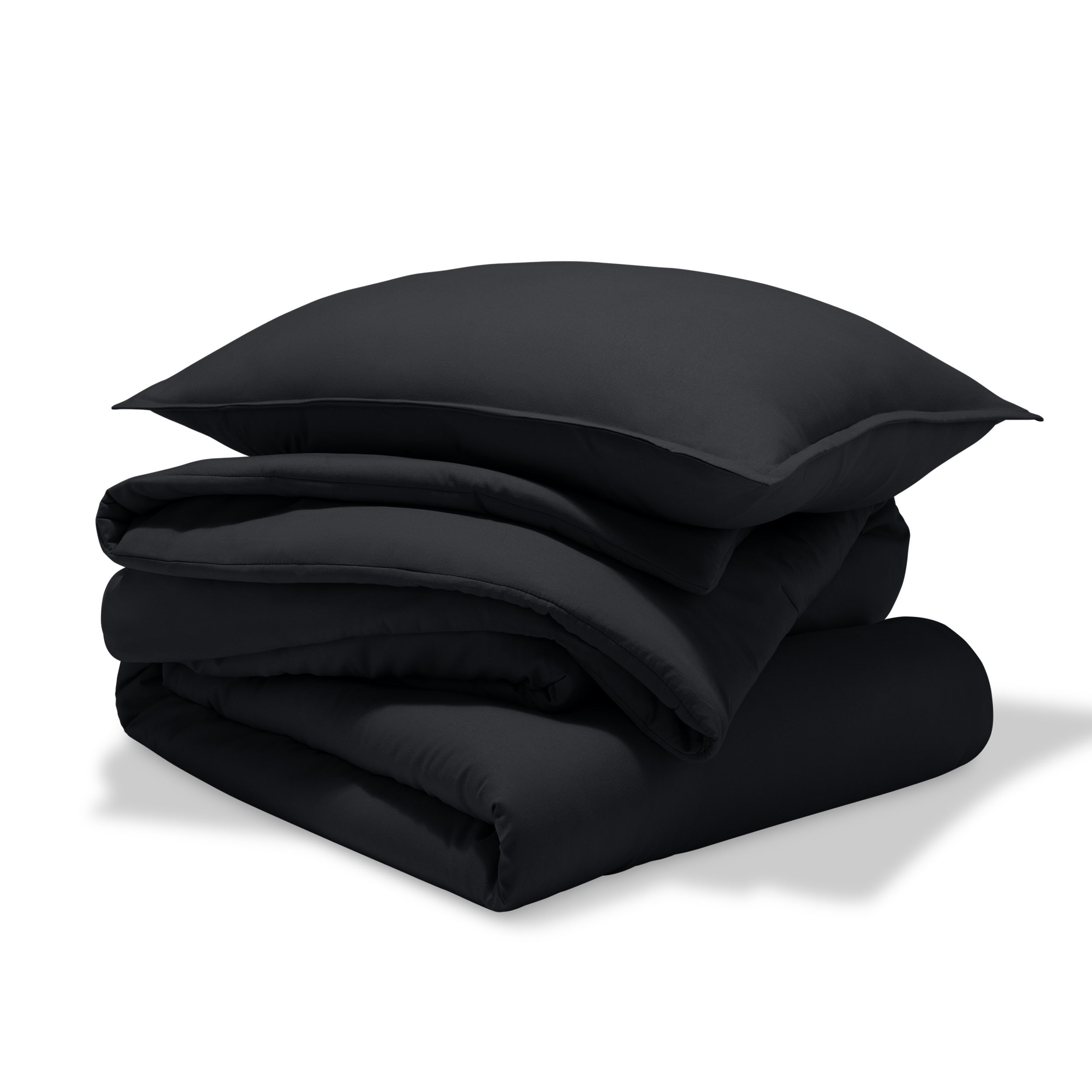 A comforter folded with a matching pillow sham stacked on top