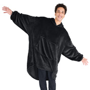 An adult with microplush wearable blanket on