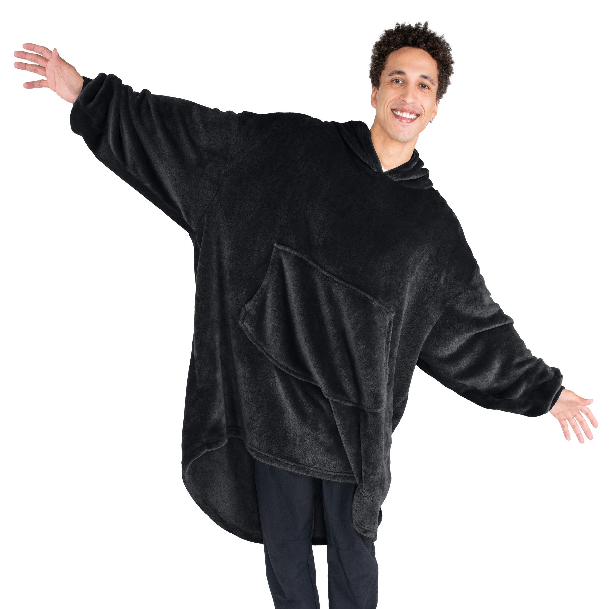 An adult with microplush wearable blanket on
