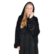 An adult with microplush wearable blanket on