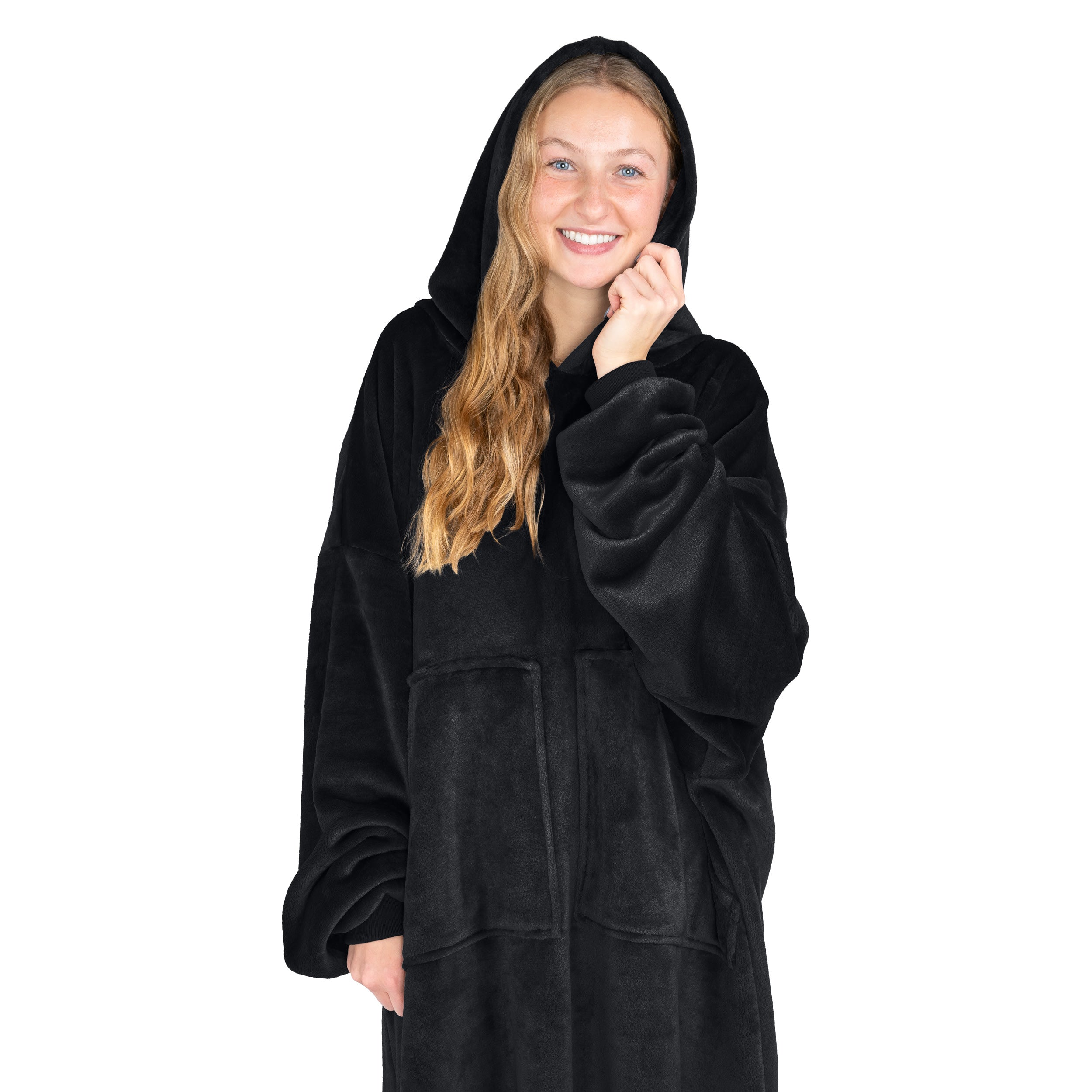 An adult with microplush wearable blanket on