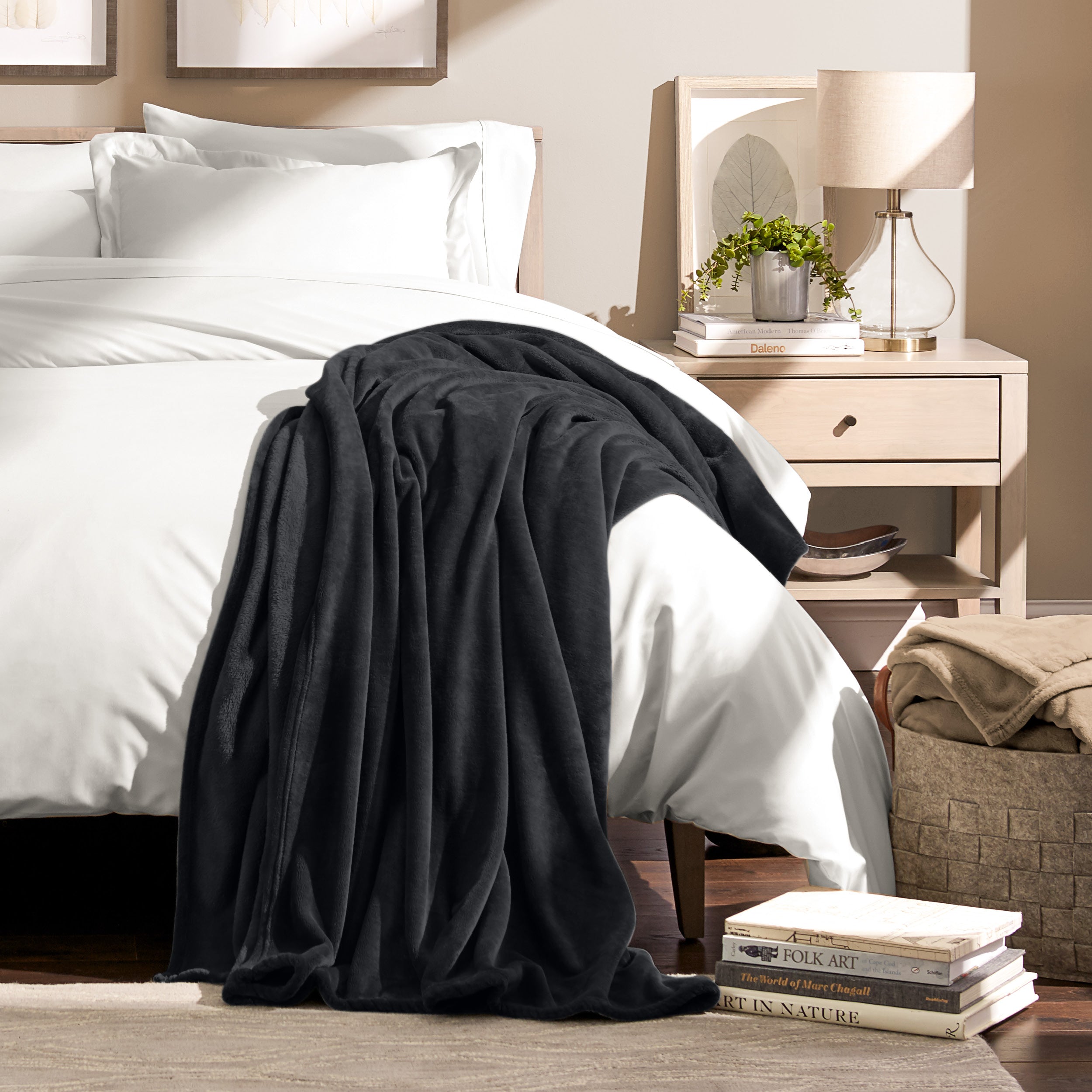 Microplush blanket laid out over a bed and folded back over itself