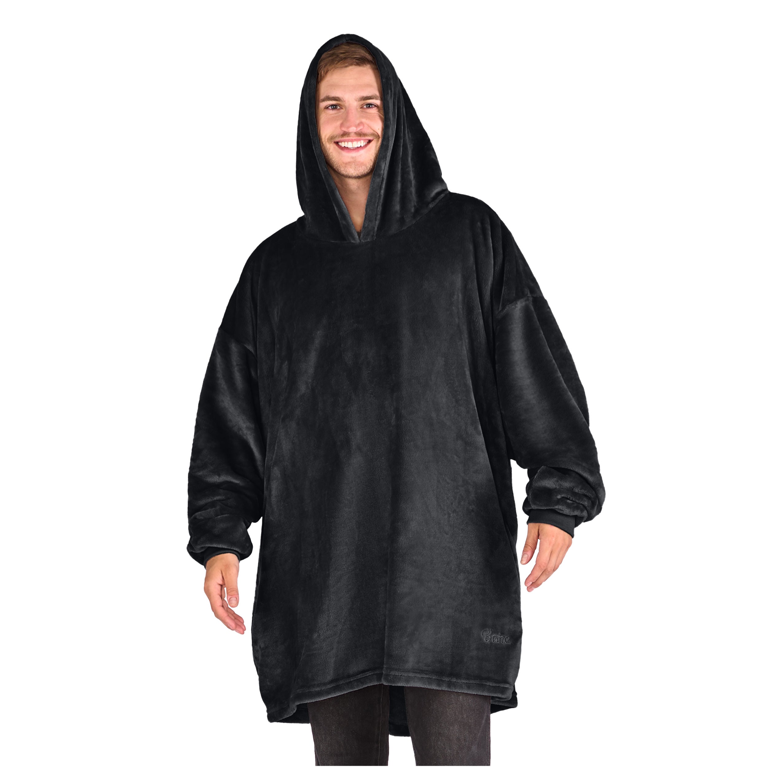 A man standing with a wearable blanket on
