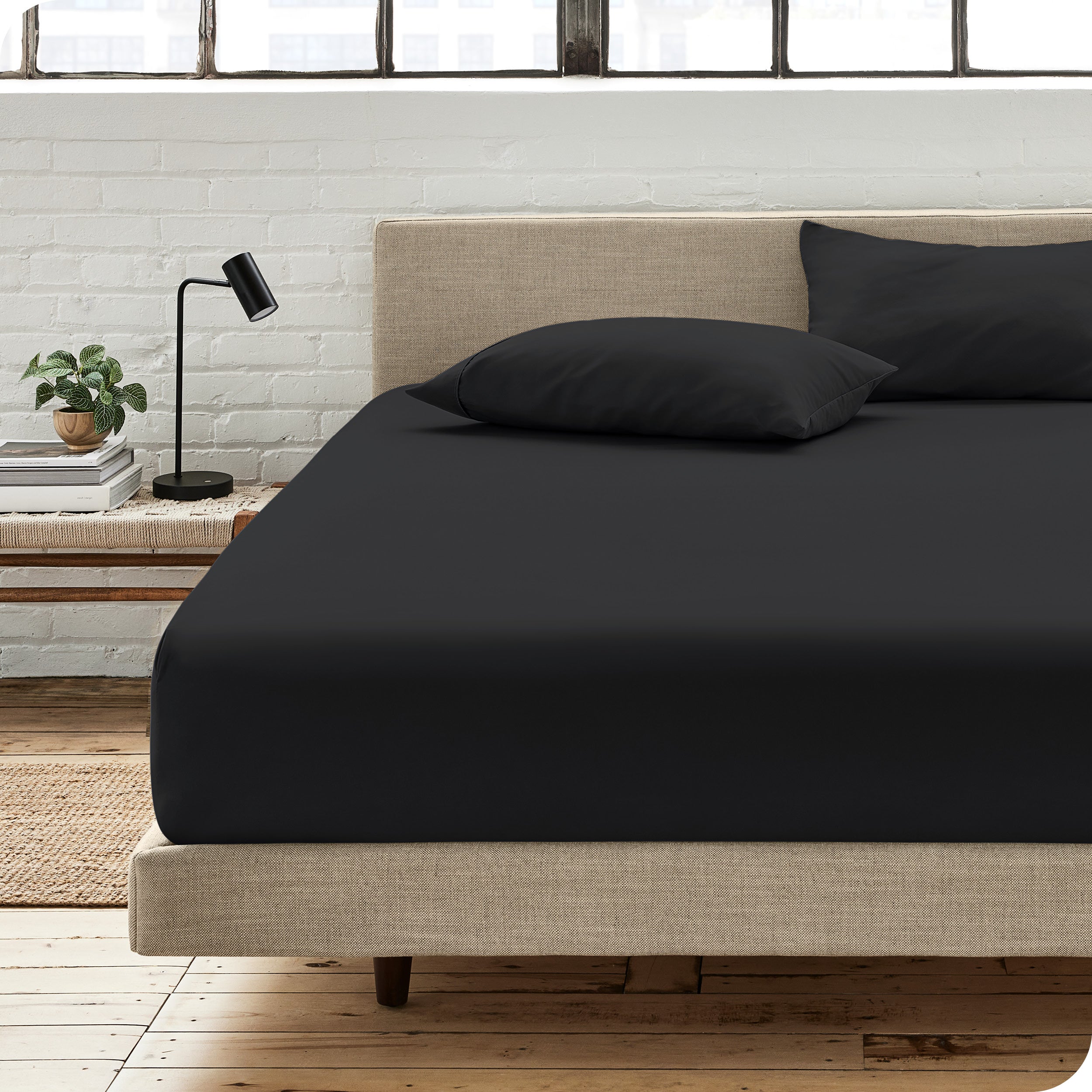 An organic cotton fitted sheet on a mattress