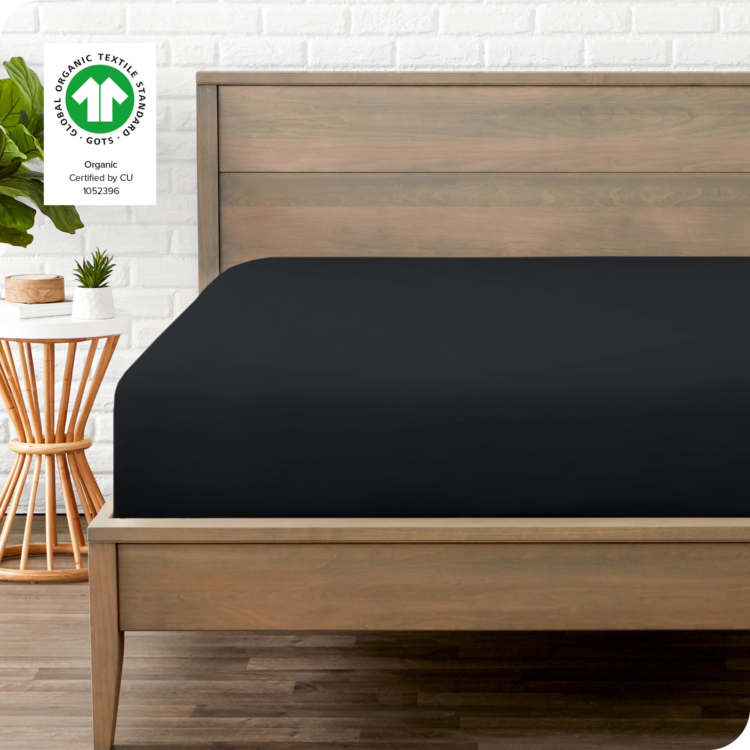 An organic percale bottom sheet on a mattress