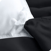 The corner ties of a duvet cover attached to a duvet insert