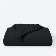A single organic cotton fitted sheet folded
