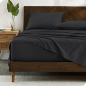 Percale sheets on bed in a modern bedroom