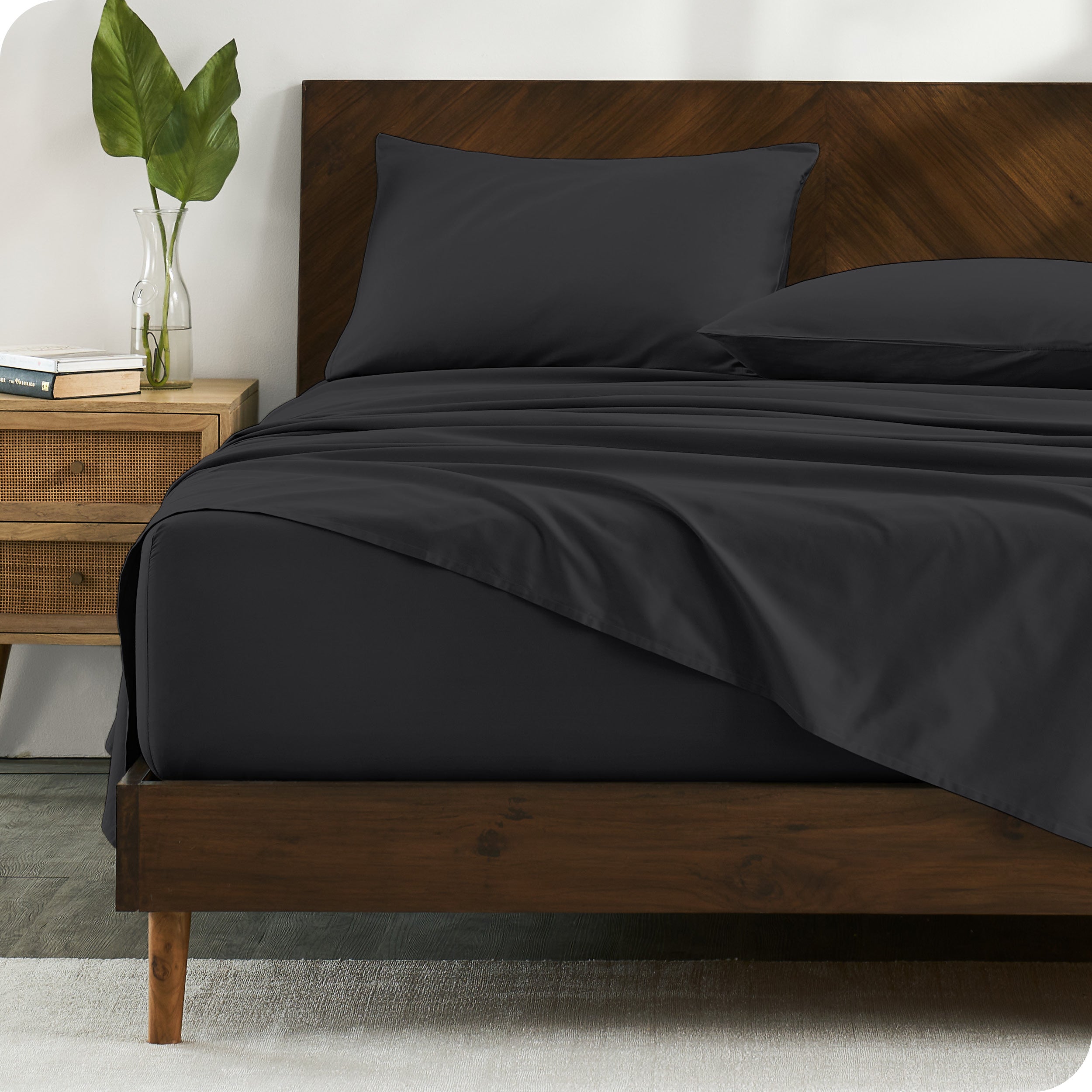 Percale sheets on bed in a modern bedroom