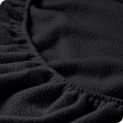A close view of a polar fleece fitted pocket showing the texture.