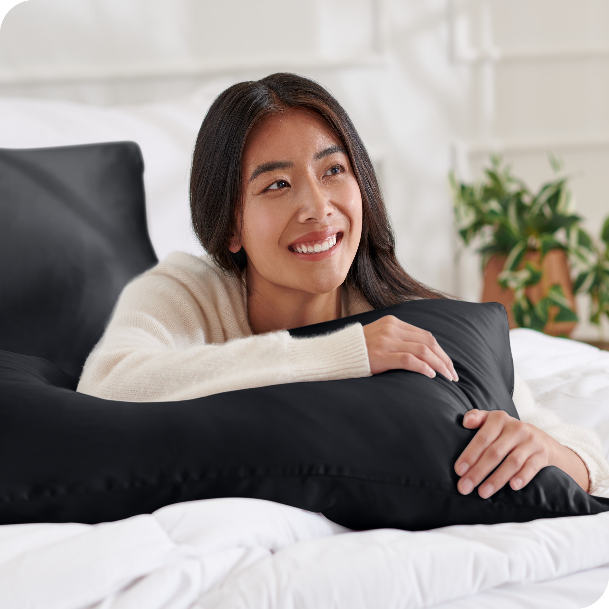 A woman resting her arm on a pillow