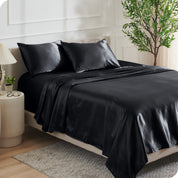 Satin sheets on a bed