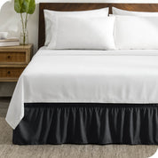 A wrap around bed skirt on a bed