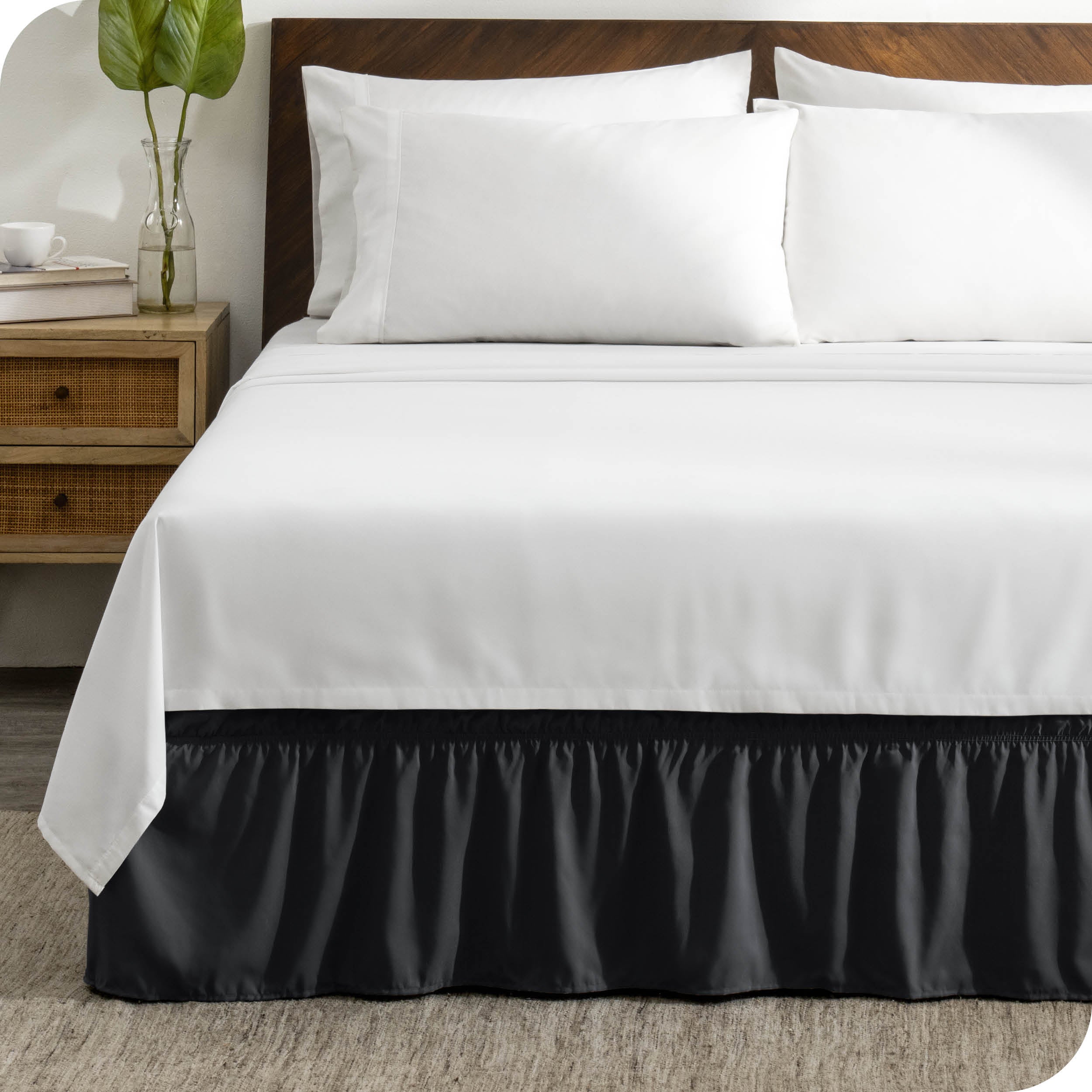 A wrap around bed skirt on a bed