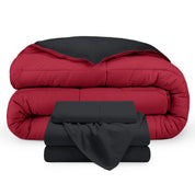 A reversible microfiber comforter and a coordinating sheet set folded and stacked 
