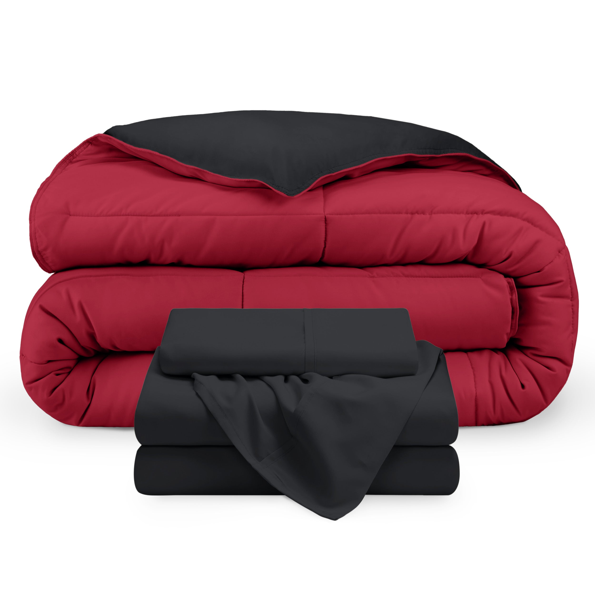A reversible microfiber comforter and a coordinating sheet set folded and stacked 